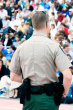 stock photo 4026922 back of police officer working crowd control at track event